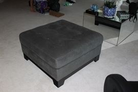 Fabric covered ottoman.