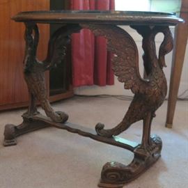 Carved wood swans with marble top side table.  