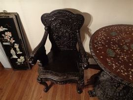 Hand carved Asian carved chair, note carved dragons on chair arms.