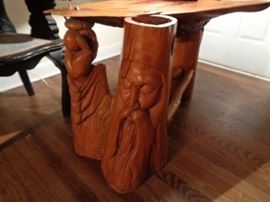 Wizard carving on front corner of Cyprus table.