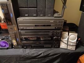 Three video disc players by Pioneer and Proscan.