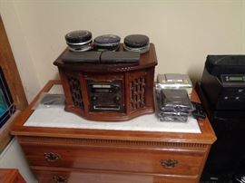 Collection of CD players, three vintage HP Pocket PC's, tabletop Crosley-Style AM/FM/CD/Cassette and turntable player with built in speakers, plays and sounds good.
