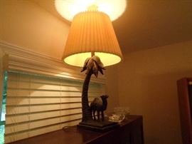 Unique camel and palm tree resin table lamp.