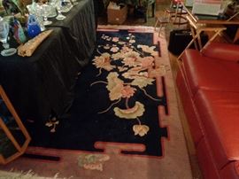 Large floral pattern wool rug . Roughly 12' x 14-16' .