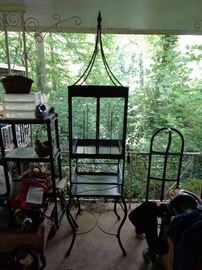 Cast iron and glass bird cage on stand. Over 6 foot tall with top finial .