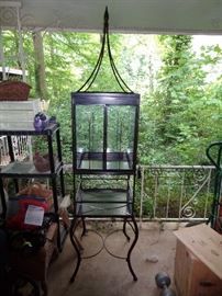 Unique iron and glass Bird Cage, over 6 foot tall with finial . Very good quality construction and ready to compliment any environment .