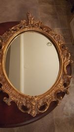 Gold leaf wood framed vanity mirror, $55.00