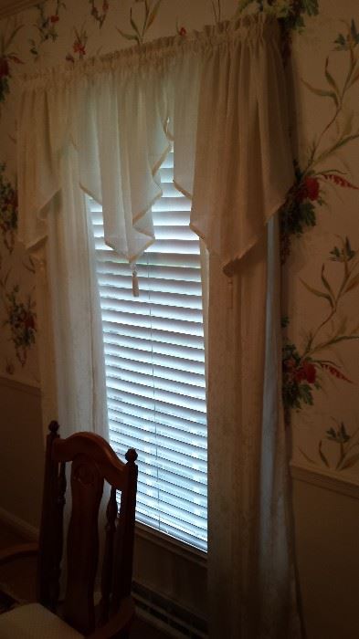 Curtains are for sale, but the blinds are not.