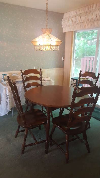 Round table and chairs with extra leaves  $100