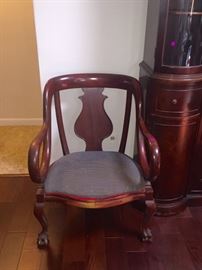 Claw foot chair with scroll arms