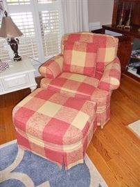 Overstuffed upholstered arm chair with ottoman
