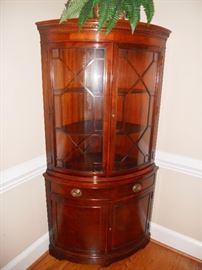 Mahogany corner cabinet with curved glass front by Drexel