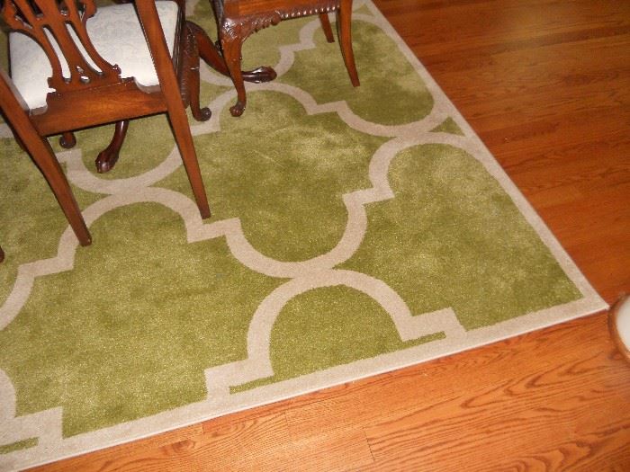 Green and white patterned rug