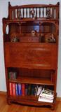 Secretary bookcase with drop front desk compartment.