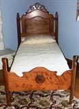 Youth bed with bulls eye decoration.