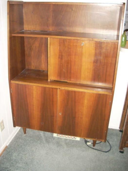 Cabinet unit has a locking desk (right mid section)         there are 2 of these