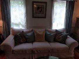 Heavy, long-low-lovely couch, by Bernhardt. The linen slipcover transforms this ugly duckling into the beautiful swan you see pictured - you even get all the pillows that can be karate-chopped into shape.