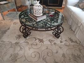 Extremely heavy cast iron table, with beveled glass top, which isn't chipped - yet.