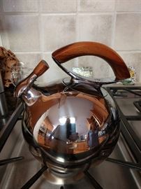 Nice selection of kitchen pots/pans. This is a Nambe teapot, there are a few other pieces, also a nice collection of Cuisnart, Lodge (cast iron), MacKenzie-Childs, Breville appliances, Crock Pot, etc.
