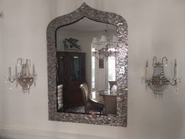 Another beautiful mirror, this one very contemporary, covered in pave mother-of-pearl, flanked by a nice pair of vintage crystal wall sconces, from the old Biltmore Hotel.