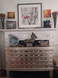 Very nice mirrored/silver-leafed buffet, that matched the dining table. Above the mantle, a nicely framed/matted print, by Atlanta artist, Marilyn Suriani. http://www.surianiphoto.com/