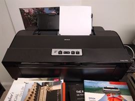 Here's the Artisan 1430 photo printer and there's lot's of paper as well.