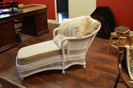 vintage pillows in the wicker chaise