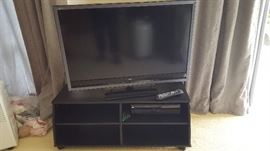 Sony Bravia Flat Screen TV, VHS player on painted black console