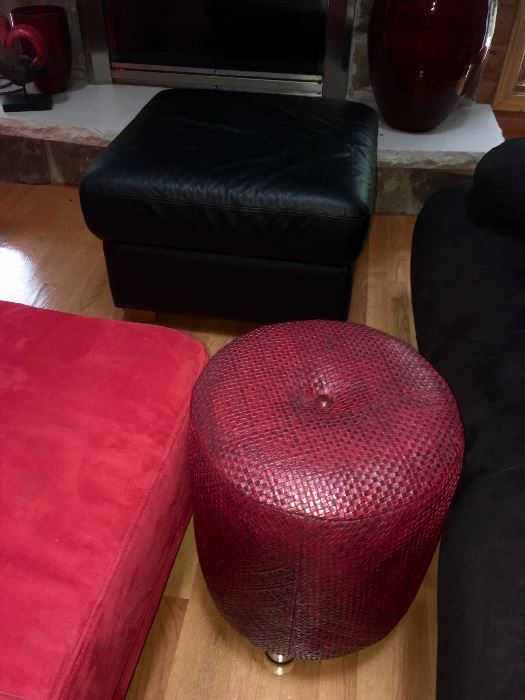 Red faux leather ottomans, black leather ottoman