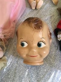 We have a great many Antique and Vintage dolls, Here is a very large Kewpie Doll Head. We Have Mattel from the 50s and 60s, Midge, Ken and many more. We have very high end collectors Dolls. Pics coming.