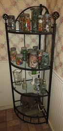 Wrought Iron And Glass 4 tier shelf. Lots of antique jars filled with goodies such as marbles, buttons, etc.