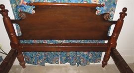 Headboard very ornate on this rope bed