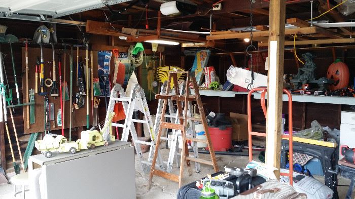 Garage full of practical items priced to sell, ladders, two-wheeler, yard tools, painting supplies, yard decorations, gardening, much more