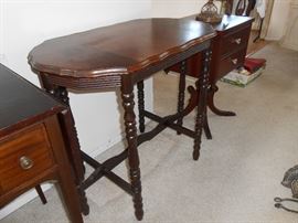 Taller foyer table but small sized.
