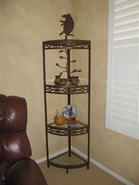 Iron Etagere - Southwest style with wonderful cut out designs.   The armadillo on the top shelf is an "earthquake detector" by Taos metal artist Franzetti