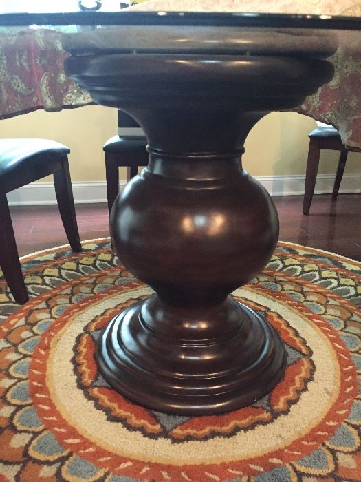 Beautiful pedestal base to glass top dining room table.  (Rug IS NOT for sale)