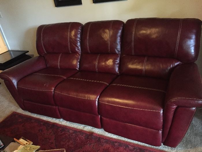 Leather couch with reclining end sections
