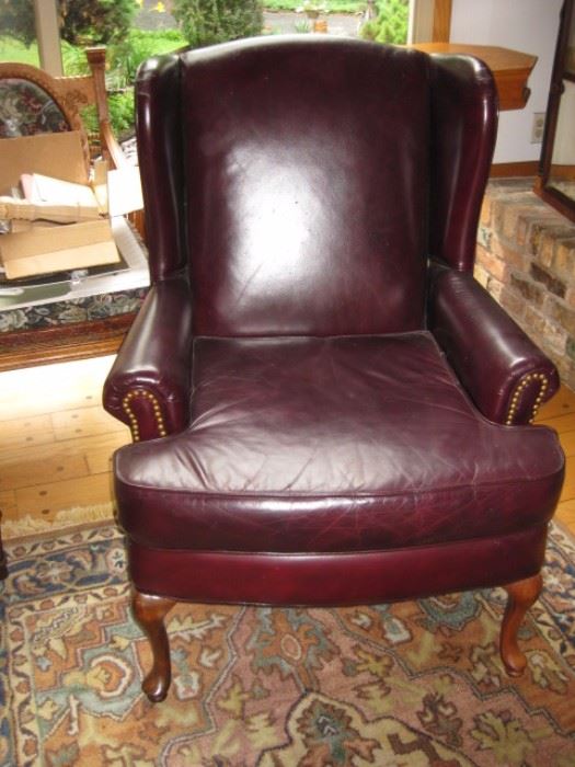 Vintage burgundy leather wing back chair