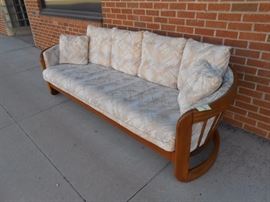 Full length sofa with pillows - soft neutrals.