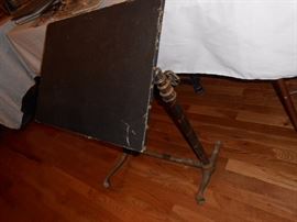 Drafting table with iron legs and cast iron feet, on wooden casters... Steampunk style!