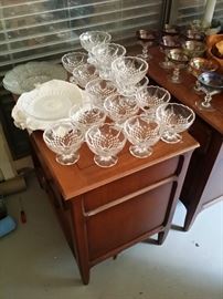dessert cups/glasses sitting on two separate matching end tables