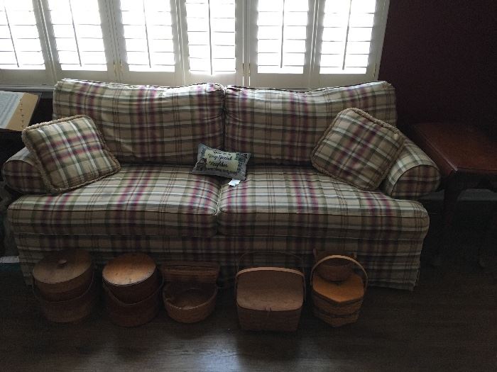 Sleeper sofa, end table, and Longaberger baskets