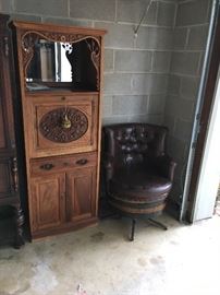 Antique secretary and Jack Daniel barrel chair