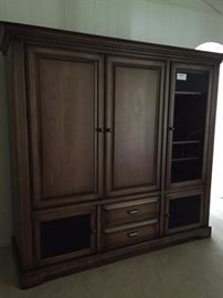 custom entertainment center hold up to 42" tv, room for stereo equipment.  Mesh doors on bottom for speakers.