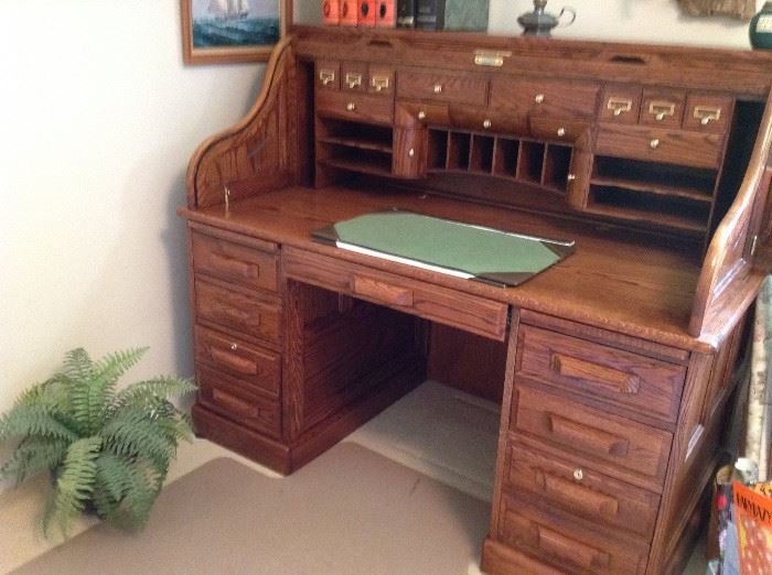 Beautiful solid oak roll top desk with hidden compartments and light
