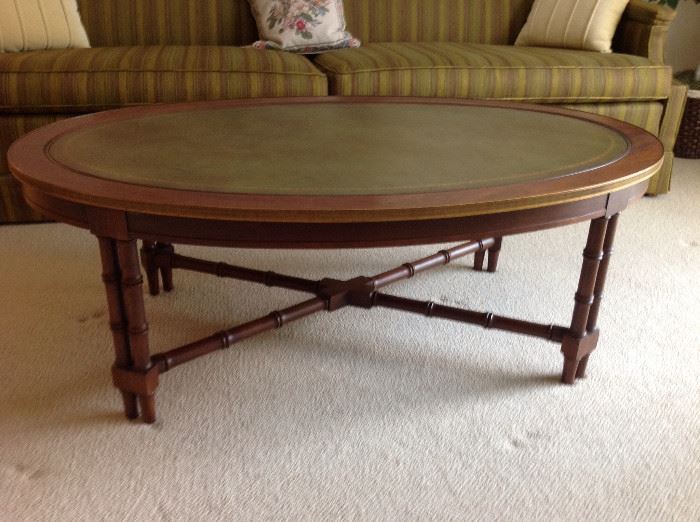 Oval wood coffee table with leather top