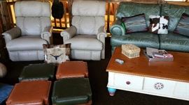 Comfortable leather recliners, sofa, ottomen, and unique coffee table