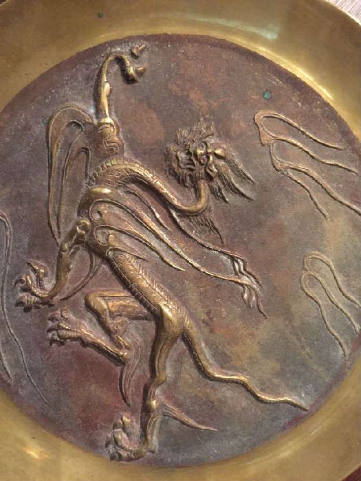 Pair of antique bronze dragon shields.