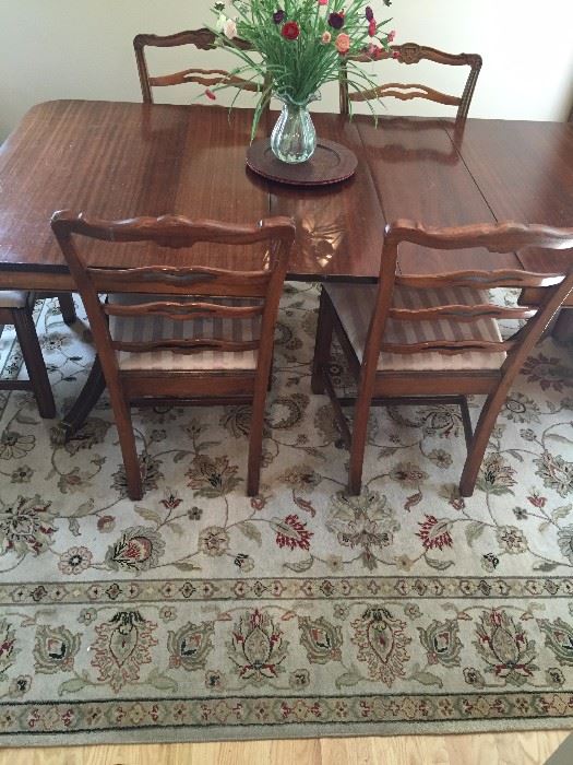 Beige oriental rug, 8'x10', hand knotted, Mahogany table with three leaves, six chairs