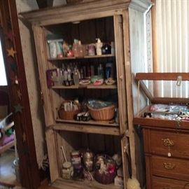Cupboard full of cosmetics, shampoos, etc.